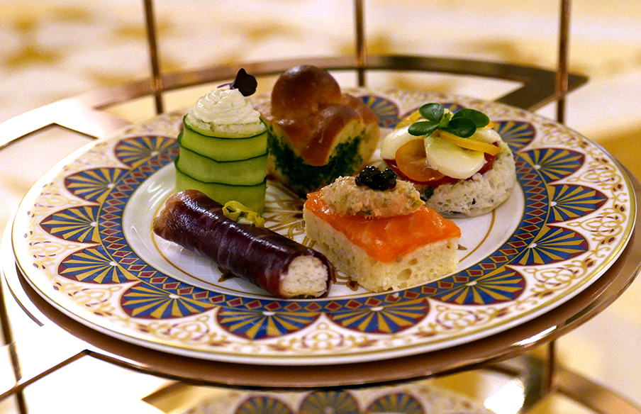 Bone china teaware plate with selection of heritage foods